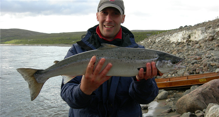 Atlantic salmon being held.